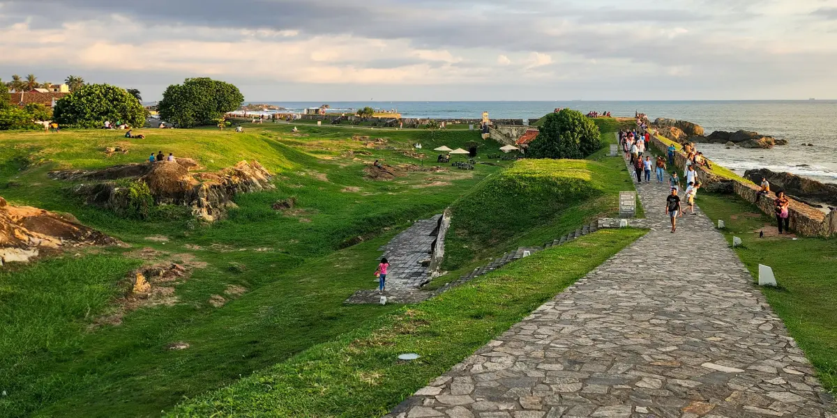 Galle Fort ramparts and lighthouse overlooking the Indian Ocean during dry season Sri Lanka