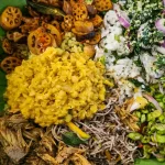 Traditional Sri Lanka rice and curry meal served on lotus flower leaf