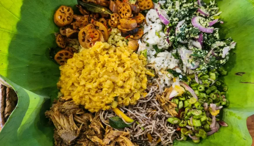 Traditional Sri Lanka rice and curry meal served on lotus flower leaf