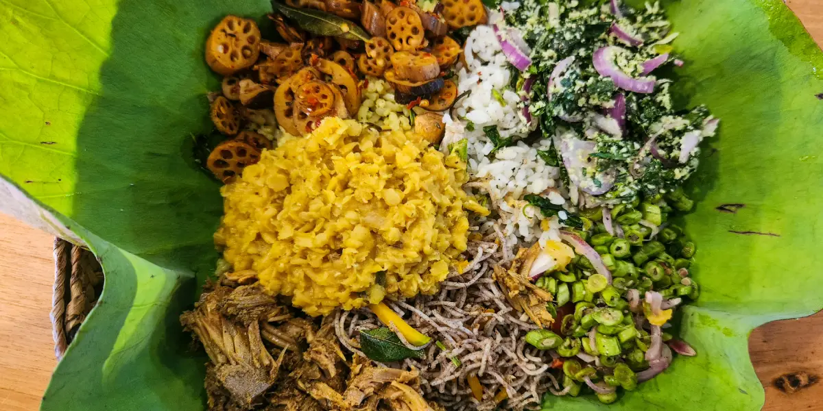 Traditional Sri Lanka rice and curry meal served on lotus flower leaf