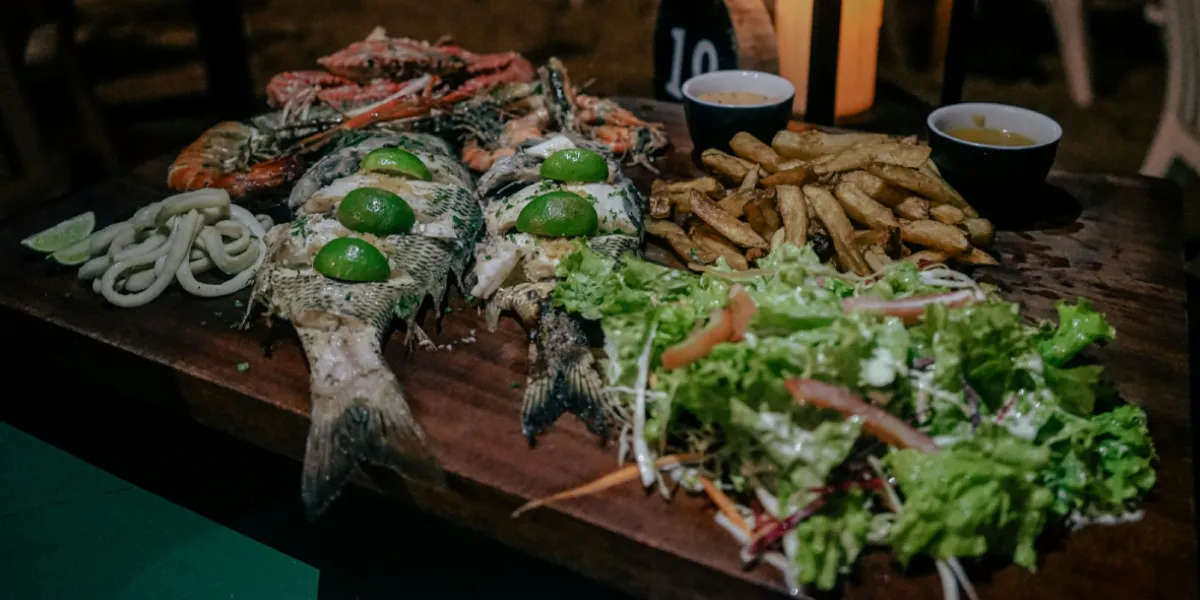 Fresh seafood platter with grilled fish crab and calamari served at a restaurant on the southern coast of Sri Lanka