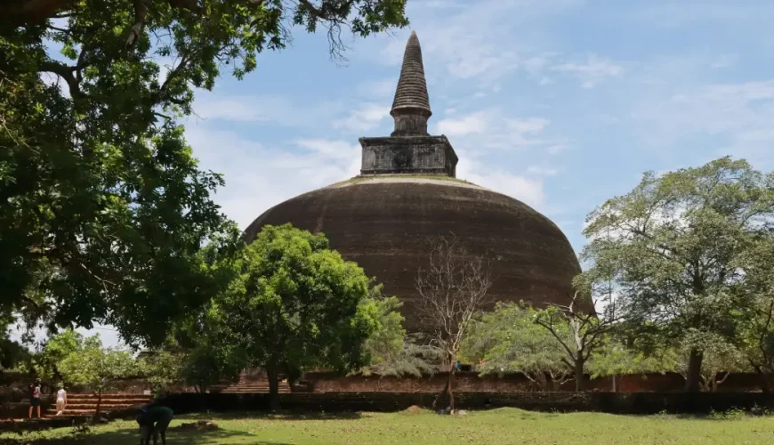 Ancient Rankoth Vehera stupa at Polonnaruwa UNESCO World Heritage Site Sri Lanka with visitors and tropical trees