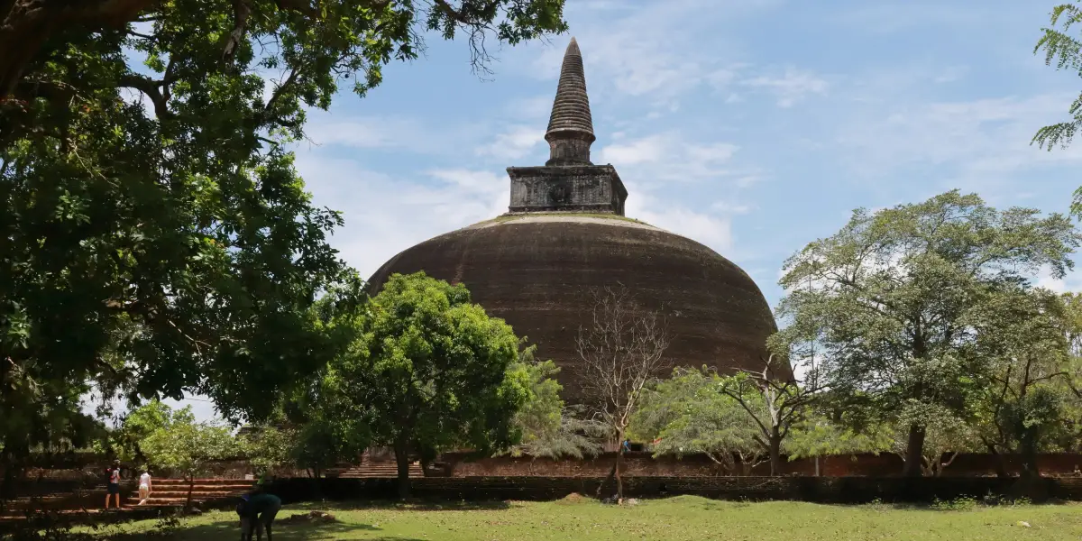 Ancient Rankoth Vehera stupa at Polonnaruwa UNESCO World Heritage Site Sri Lanka with visitors and tropical trees
